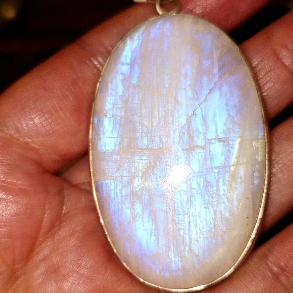 Large Rainbow Moonstone Sterling silver pendant. stone has natural imperfections as seen.