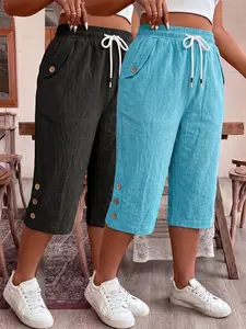 Women’s loose shorts with an elastic waistband and drawstring design; casual short pants with decorative buttons for comfortable everyday wear.
