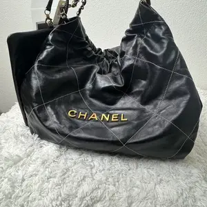 Pre-owned CHANEL LambSkin Travel Bags 22 handbag featuring gold tone hardware