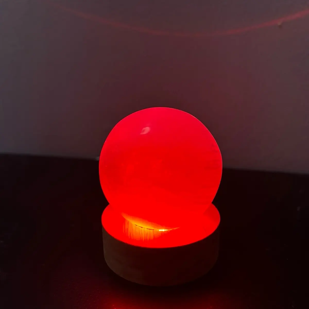 Selenite crystal sphere with LED color changing wooden holder
