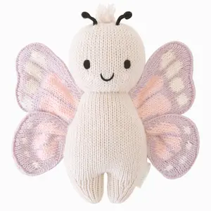 cuddle+kind Baby butterfly 7" hand-knit doll - gives 5 meals, fair trade, 100% cotton yarn