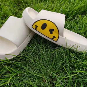 Emoji Slides Pantunflas Chanclas Footwear with Yellow Smiley Face Design on White Sole