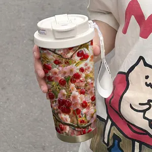 This 500ml insulated mug features a cherry blossom design, reminiscent of springtime fruits and flowers. Portable for car use, it keeps drinks hot or cold, making it suitable for the office, travel, and as a gift. Perfect for coffee cups and mugs.