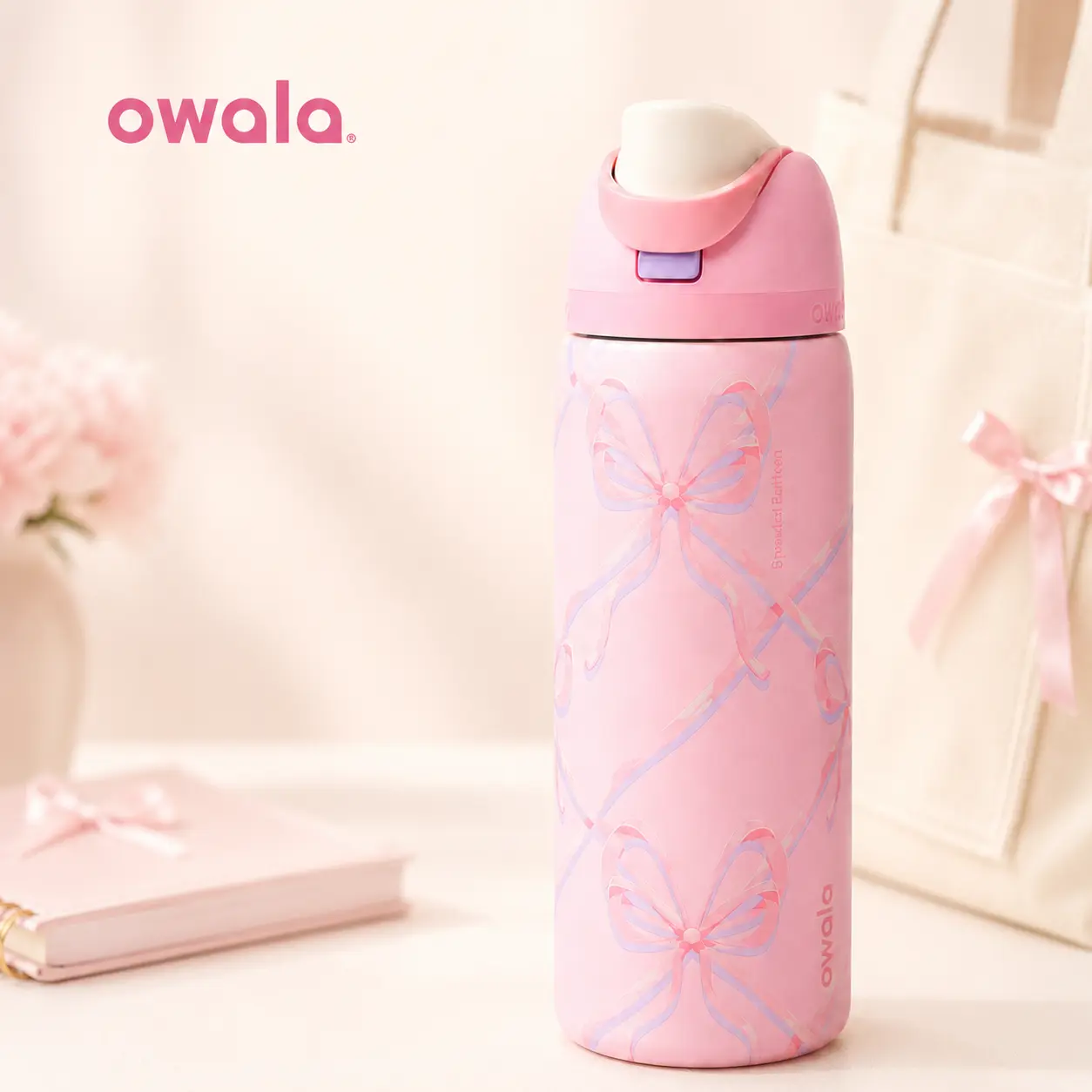 Owala FreeSip Pink Bow Insulated Stainless Steel Water Bottle with Built-In Straw and Carry Loop