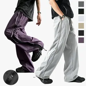 Men’s trendy loose parachute pants featuring side dual zippers and breathable mesh paneling; 100% polyester tower velvet fabric with a structured feel and wear resistance; street-style functional design; versatile for everyday commuting and outings.