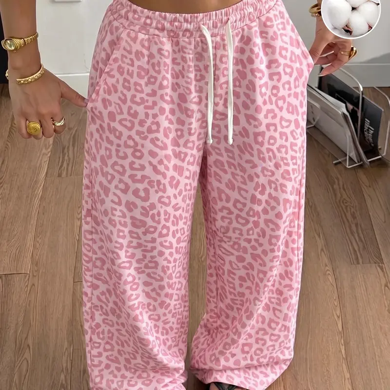 Women’s leopard-print wide-leg pants, made from a soft cotton blend with an elastic drawstring waist; loose, relaxed-fit trousers for home, everyday wear, and street casual style, featuring a fluid drape.