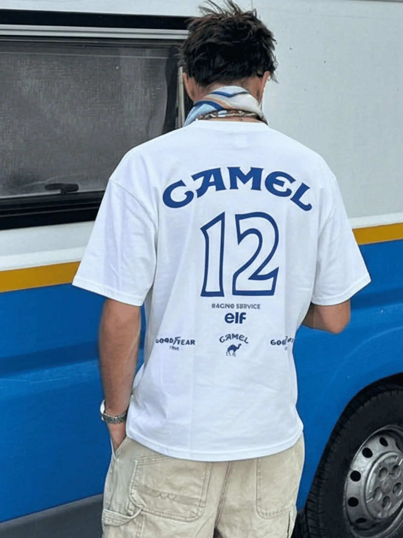 1 PCS Camel Number 12 Racing Service Team Jersey Distressed Back Graphic, Retro Motorsport Goodyear Elf Sponsor Grunge Streetwear Tee, Soft Breathable Unisex Top For Vintage Race Fans Casual Outfit