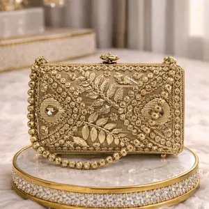 Antique Gold Metal Clutch with Beautiful Leaf Design and Beaded Straps for Elegant Occasions