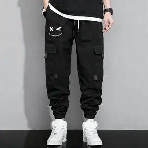 Men's jogger work pants featuring multiple pockets for practicality and style, adjustable drawstring waistband, loose fit suitable for streetwear enthusiasts