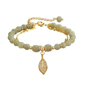 Natural Hetian jade gold-leaf lady's bracelet. Luxurious double-layered pearl chain, suitable for ladies to wear at parties and weddings. It is an excellent gift choice.