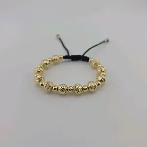Pulsera Ajustable de Hilo con Esferas Diamantadas en Oro Laminado 14K