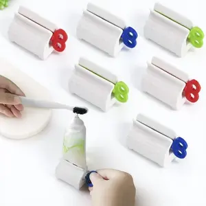 Strong Adhesive Toothpaste Squeezer, Roller Style 360 Degree Rotation No Corner, Bathroom Counter Storage Holder Anti-Slip Moisture Proof, Wall Mountable Toothpaste Tube Clip Set