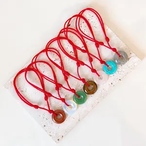 Knot Bracelet with Red Cord and Green & Red Disc Pendants for Stylish Accessory