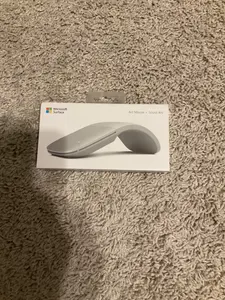 The Microsoft Surface Arc Bluetooth BlueTrack Ambidextrous Mouse in light grey