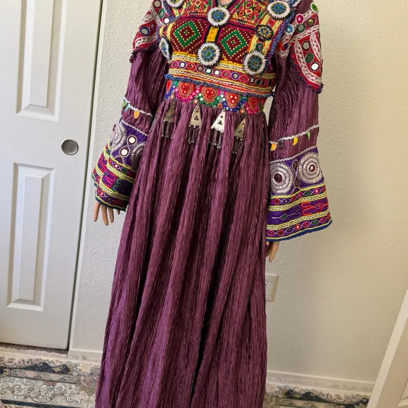 Traditional Afghan Kochi Dress   Beautiful traditional Afghan Kochi dress available in green and cream colors. The neckline and sleeves are hand-embroidered with beautiful traditional Kochi designs.   Cream: Size M — 1 available  Green: Size L — 1