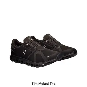 Lightweight performance running sneakers with segmented shock-absorbing cloud outsole and locked lacing system, crafted from tear-resistant breathable mesh. Solid black tonal design makes this must-have elevate athletic and casual daily outfits.
