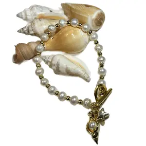 Seashell Pearl Bracelet with Gold Star Charm and Shell Accents Elegant Fashion Accessory