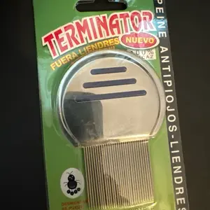 Metal head lice comb.
