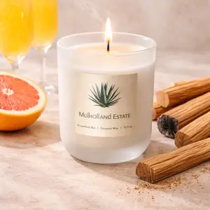 Grapefruit Sky 10.5 oz Candle. Bright grapefruit, a hint of mimosa fizz, and warm palo santo— impossible not to love