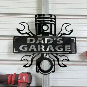 Dad's Garage 24 Inch Metal Sign with Wrenches and Piston Design for Workshop Decor