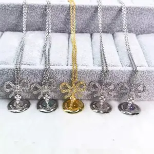 Y2K Style Queen Mother West Mini Little Saturn Pearl BowPin 3D Planet Necklace Premium Titanium Alloy Durable Jewelry for Daily Wear & Parties