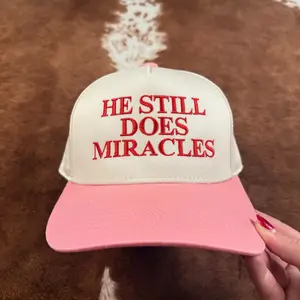 He Still Does Miracles Trucker Hat