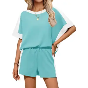 Women's two-piece summer outfit with oversized short sleeved top and shorts matching setRAIMENTRY