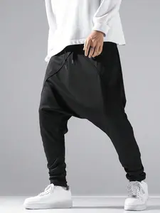 Dark-themed men’s harem sweatpants in plus sizes—loose, baggy street-style jogger pants with a patchwork design and cuffed ankles. Made from comfortable fabric that feels like a second skin, they pair well with any top or shoes and are perfect for fashion
