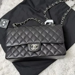 Pre-owned CHANEL Caviar Shoulder Bags Classic Flap bag in black quilted leather with silver hardware