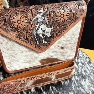 Tooled leather and cowhide crossbody with bull rider