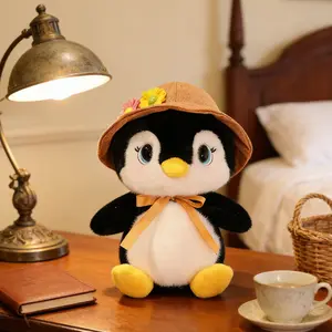 Cute Penguin Plush Toy with Floral Hat & Bow Soft Stuffed Animal for Kids & Collectors Adorable Black & White Penguin Cuddly Plushie Gift for Bed & Decor