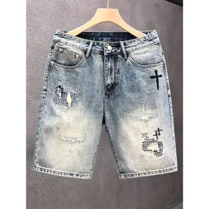 Men's vintage blue washed denim shorts with cross embroidery, loose straight cut, American dark style, five-point shorts. Men's distressed washed loose casual denim shorts with embroidery in American dark style