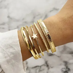 Gold Bangle Bracelet Set for Women, Vintage Boho Style Layered and Textured Chunky Cuffs with an Open Star Bangle for Holiday Parties