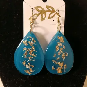 Teal droplet earrings with gold accents