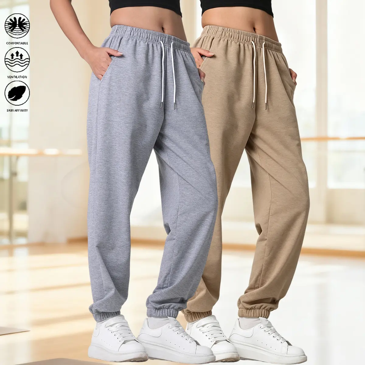 Women’s two-pack soft athletic sweatpants with an elastic drawstring waistband, suitable for home lounging and workouts, loose fit.