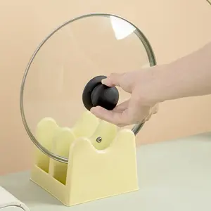 Multifunctional pot lid and cutting board holder for kitchen countertop. Freestanding design with drainage structure. Stores pot lids and cutting boards, keeps counter tidy, saves kitchen space.