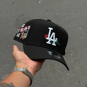 New Era 9FORTY LA Dodgers Adjustable Cap – Black Curved Brim Hat with Floral LA Logo & Japan-Inspired Side Patch