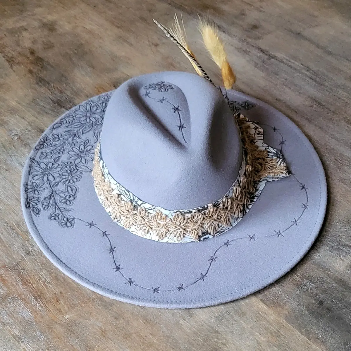 "Stormy" is our new grey burned felt fedora cowgirl hat with feather and wheat. fully adjustable