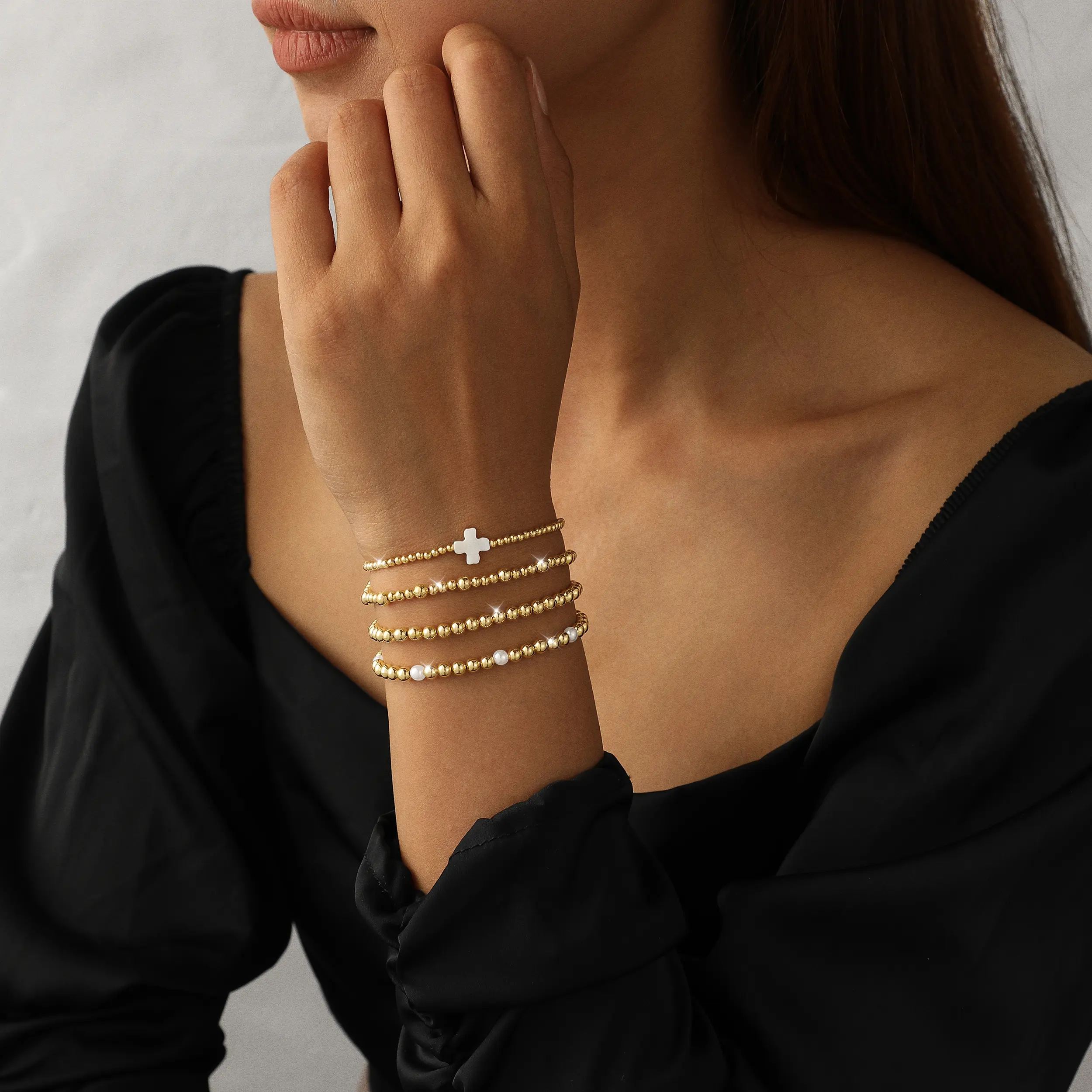 ASCOMY 14k Gold-plated 4-Piece Stackable Gold Beaded Bracelet Set | Boho Pearl & Cross Charm Design | Trendy Layered Wrist Jewelry for Women | Everyday & Party Chic Vibes