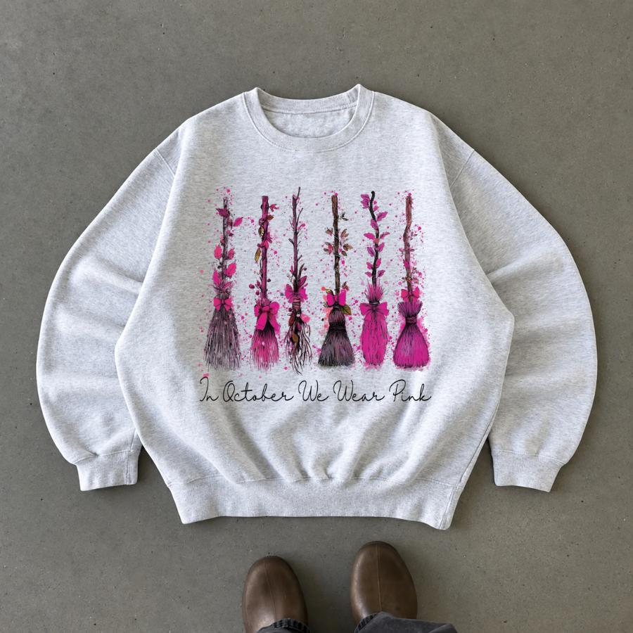 In October We Wear Pink Sweatshirt, Breast Cancer Awareness Witch Broom Shirt, Pink Ribbon Halloween Crewneck, Spooky Season Support Gift, Breast Cancer Fighter Fall Pullover