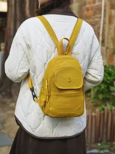 Compact yet spacious solid-color backpack with multiple pockets Versatile crossbody bag for everyday commuting Stylish and versatile tote bag for college students Spring collection women's multifunctional backpack