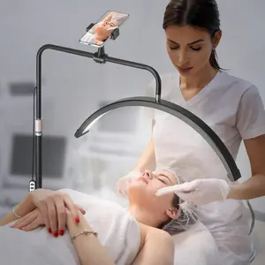 Modern 23'' LED Half Moon Floor Lamp with Phone Holder, Adjustable Lash Light for Beauty Salon, 360° Rotation, Perfect Christmas/Birthday Gift table