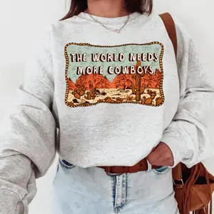 The World Needs More Cowboys Sweatshirt, western clothing, western tops, western cowgirl stuff, punchy western wear, western outfits for women, country girl stuff clothing, graphic tees women, sweatshirts for women, western for women country girl clothes