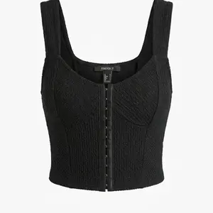 This is a Forever 21 hook-and-eye corset crop top in black textured knit fabric. Size M