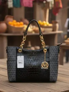 Beautiful Black Leather Handbag with Gold Accents and Stylish Design for Everyday Use