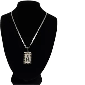 22-inch silver chain with initial pendant both in Plata 925