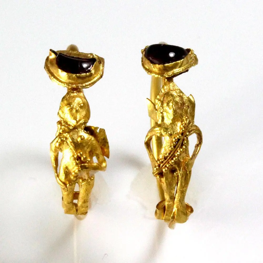 A Pair of Gold and Garnet Earrings Depicting Eros, Hellenistic Period, ca. 2nd - 1st century BCE