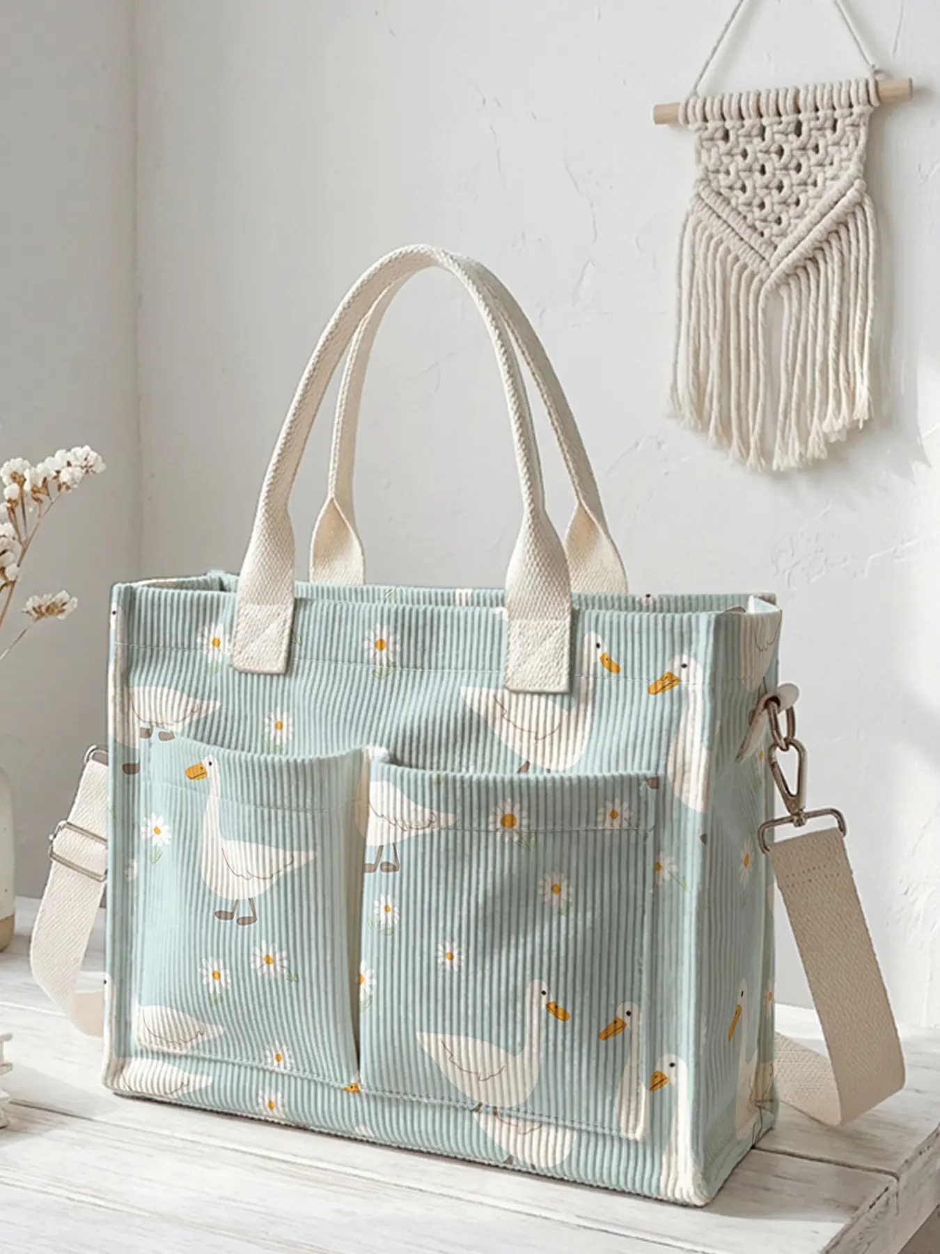 A Travel Shoulder Bag with a duck pattern print, Multifunctional Daily travel bag, featuring a large-capacity durable and wear-resistant. With multiple pockets, it maximizes space and is suitable for various scenarios such as work, shopping, and picnics