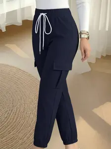 Women's stretch trousers with a drawstring waist design. Comfortable, Chic and stylish women's casual pants, perfect for daily wear and leisure occasions.