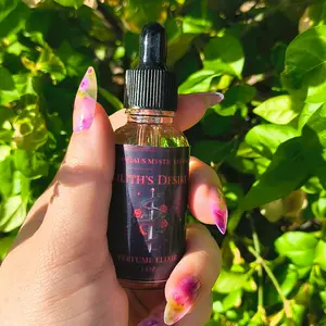 Lilith's desire - intention anointing elixir infused with rose petals and black tourmaline crystal chips